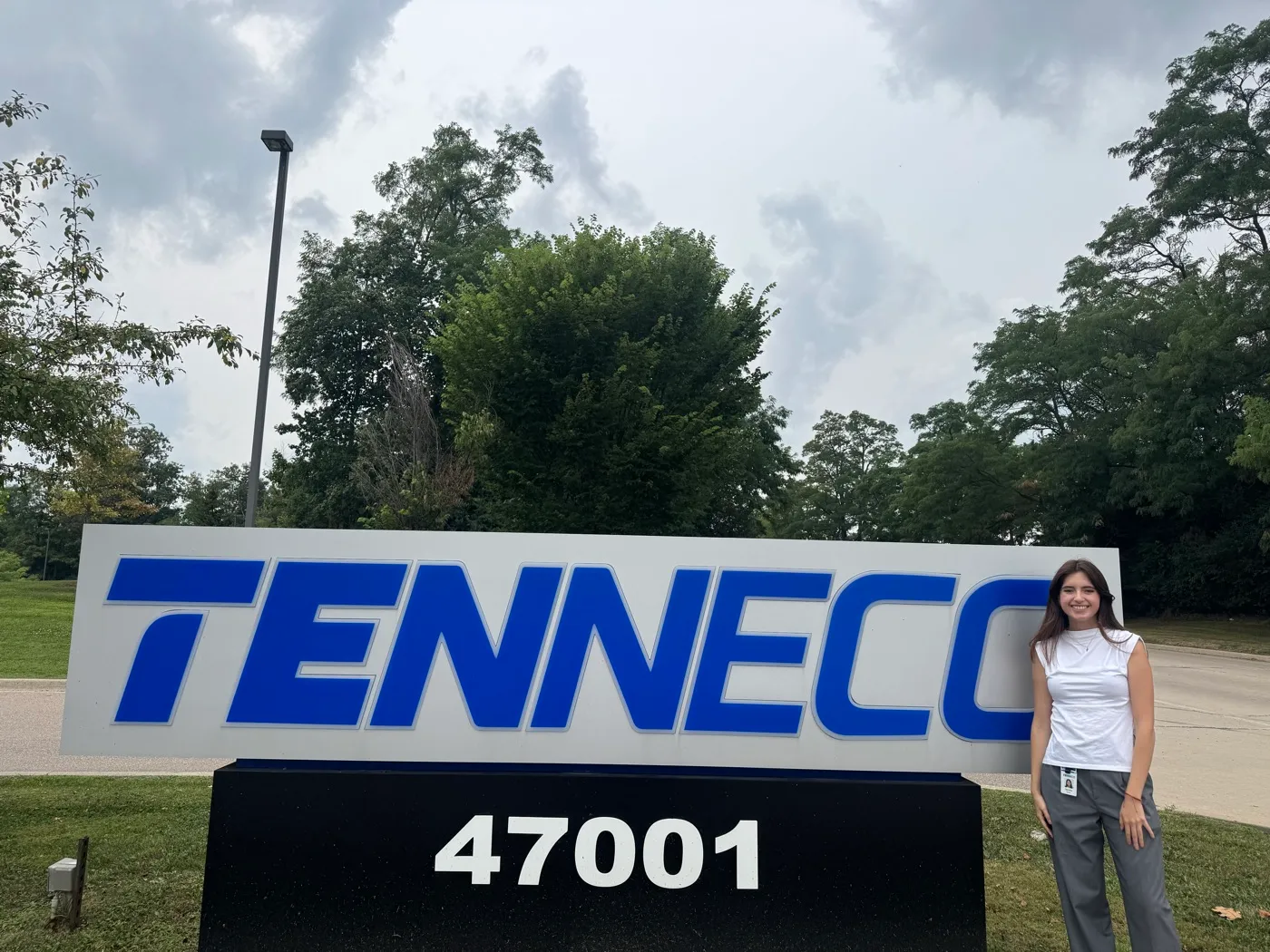 Daniela beside the Tenneco sign in Plymouth
